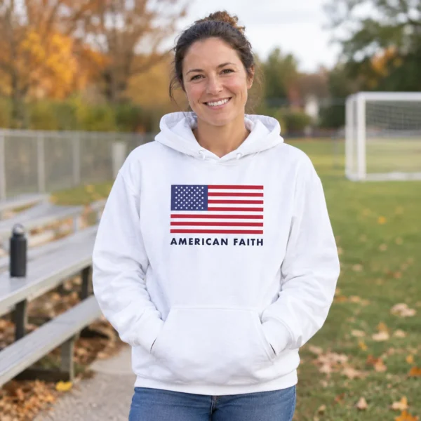 Woman at a sports field wearing the white American Flag hoodie